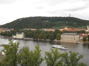 Petřín with its lookout tower above the Vltava, seen from the Old Town Bridge Tower