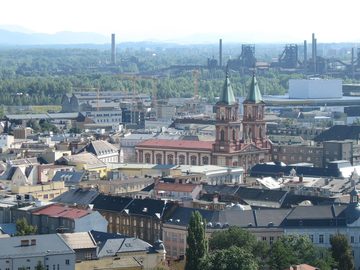 Cathedral of the Divine Saviour, behind it Nová Karolina and the blast furnaces of Lower Vítkovice
