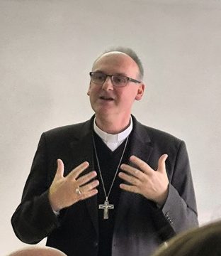 Bishop Stanislav Přibyl giving a lecture, December 2025